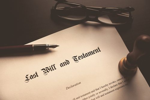 Last Will and Testament concept. Fountain pen, seal on desk